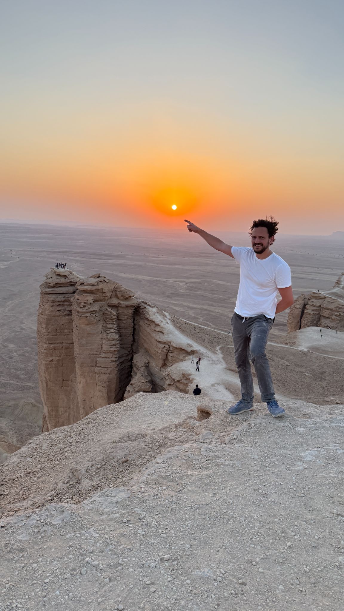 On the ground in Saudi Arabia, sunset over the escarpment